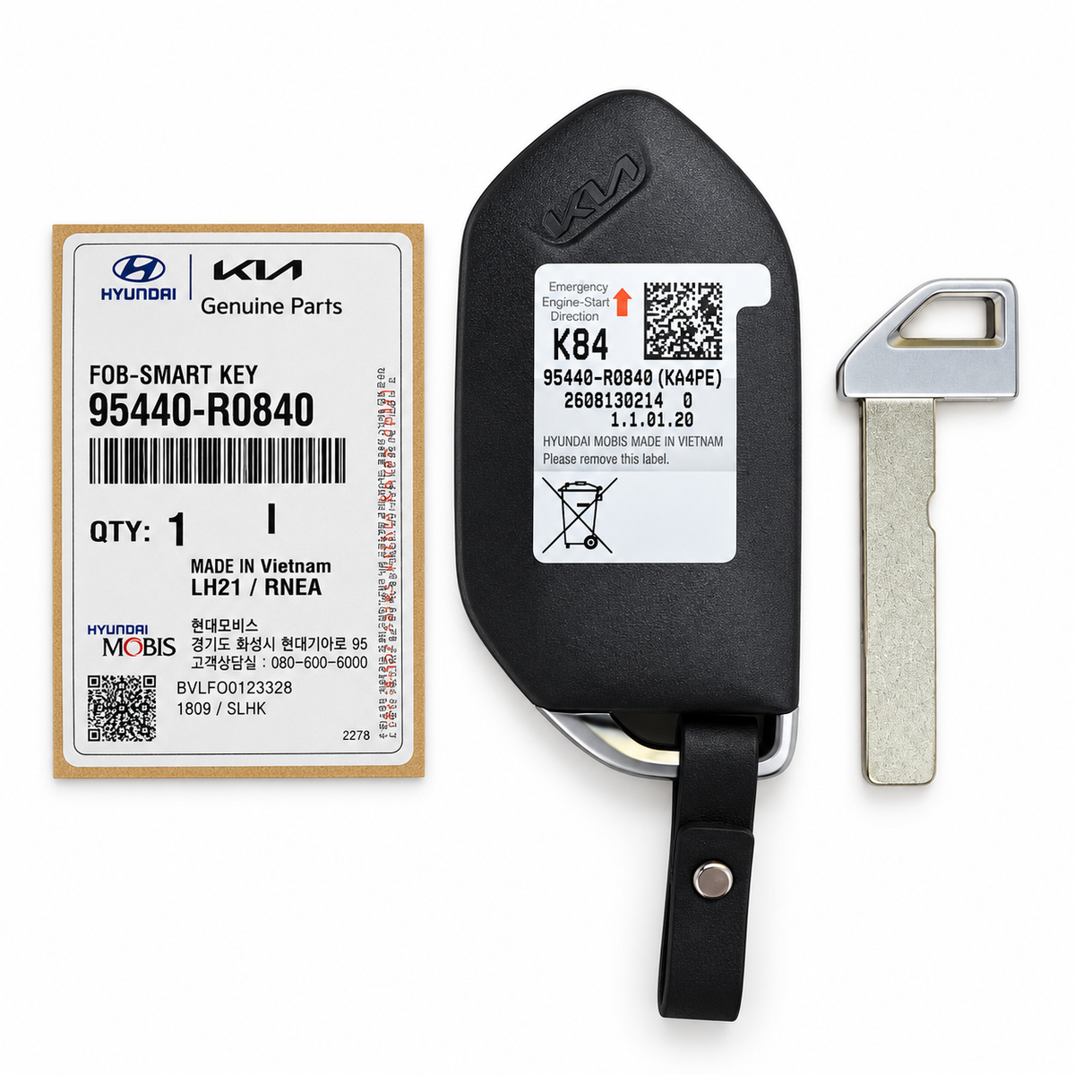 Back of Kia OEM smart key fob 95440-R0840 with Hyundai Mobis parts label and separate emergency key blade.